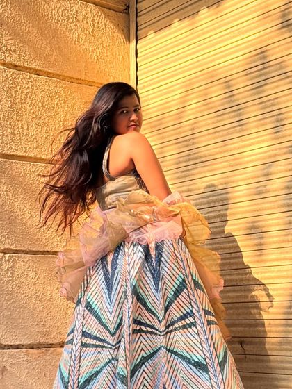 A unique and modern lehenga with a geometric sequin skirt and a ruffled dupatta. Perfect for the fashion-forward wedding guest.