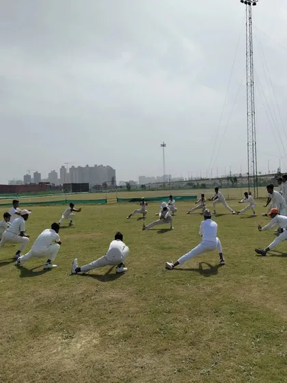 Our warm-ups are not just about running. We focus on dynamic stretching and mobility exercises like these side lunges to prepare your muscles for explosive cricketing movements and reduce injury risk.