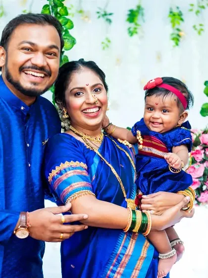 Documenting a traditional naming ceremony is a special honor. Here, the family is coordinated in beautiful royal blue, their smiles radiating happiness as they celebrate this important cultural milestone with their little one.