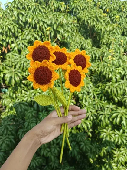 A handful of five classic sunflowers.