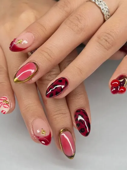 A bold and playful set with a mix of red, leopard print, 3D cherries, and gold accents.