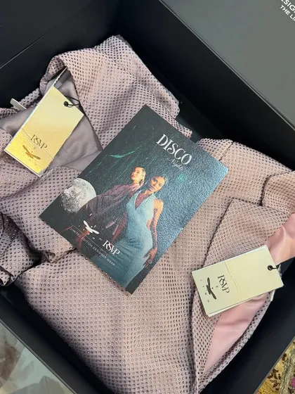 A PR package created for the Itrh x RSVP label collaboration for Nykaa Fashion, featuring a designer dress in a sleek, branded box.
