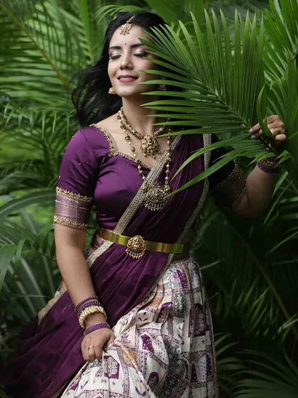 A candid moment with the model smiling, her eyes closed, creating a feeling of peace and contentment amidst nature.