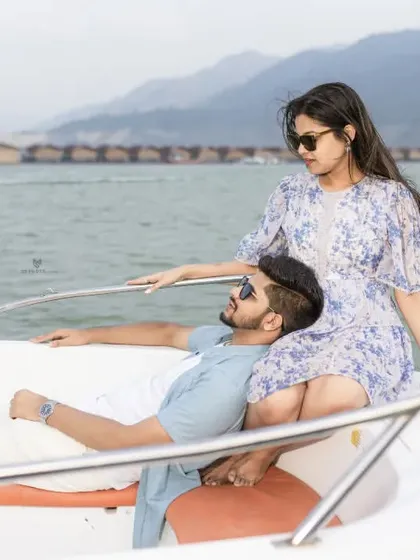 A romantic pose on the boat with the floating huts of Tehri in the background. This showcases one of the unique location features I can arrange for your shoot.