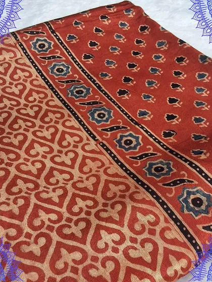 A close-up of our Ajrakh printed modal fabric, showing the fine details of the handblock printing. This fabric is perfect for those who appreciate artisanal textiles.
