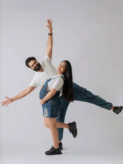 Maternity shoots can be fun and playful too! This couple chose a casual denim theme in the studio for a lighthearted and joyful session celebrating their journey to parenthood.