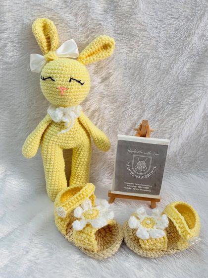 This sweet baby gift set pairs a yellow bunny doll with matching daisy-themed sandals, perfect for a sunny day.