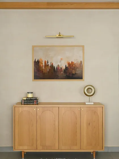 A minimalist sideboard in light oak, featuring clean lines and arched groove details on the cabinet doors.