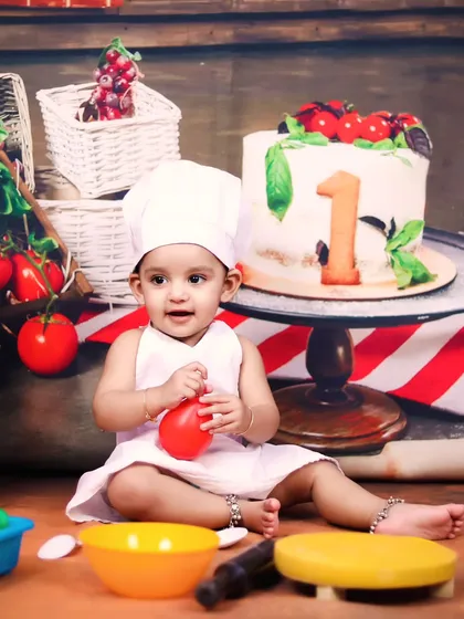 Our little chef is ready to cook, dressed in a chef's hat and apron in our pizzeria studio set.