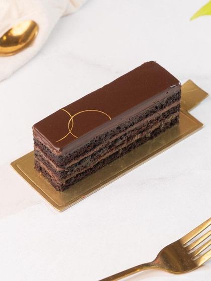 A slice of my signature Chocolate Truffle Pastry. Made with the finest Belgian dark chocolate, it's an intense and indulgent experience for true chocolate connoisseurs.