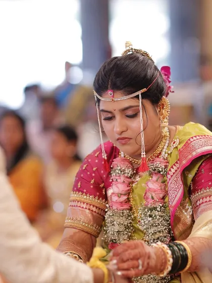 A focused moment during the ceremony. The makeup is set to last through long hours and emotional moments, ensuring she looks flawless throughout.