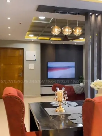 A view from the dining table towards the living room. This shot shows how we create a cohesive design across different areas using complementary colors and lighting.