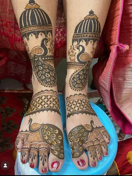 Bridal mehandi isn't just for the hands. I create stunning, intricate designs for the feet, like this one featuring majestic peacocks and detailed patterns that extend from the toes to above the ankles, ensuring a complete bridal look.