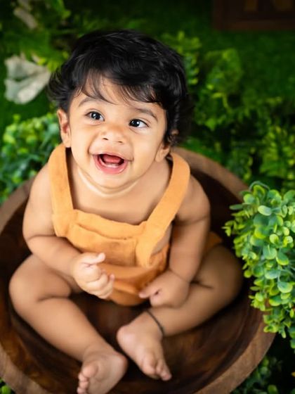 A big, happy laugh from this little boy during his fun-filled jungle photoshoot.