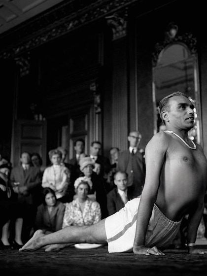 B.K.S. Iyengar demonstrating Bhujangasana (Cobra Pose) to an audience in 1954. Even in his early years of teaching, his presence and precision were captivating, showing the power of a practice rooted in deep personal experience.