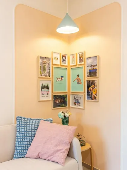 Our favorite part of designing is creating cozy corners. This accent frame wall adds a personal touch and a splash of color to the living room.