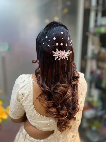 A glamorous half-updo with scattered crystals, perfect for adding a touch of sparkle to your look.