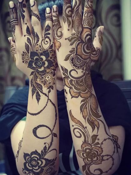 A dramatic and modern floral vine design that twists up both arms, creating a beautiful and eye-catching look.