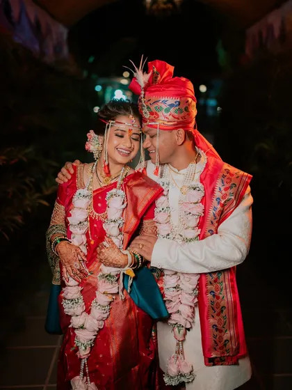 A candid and joyful moment between the couple, capturing their genuine happiness.