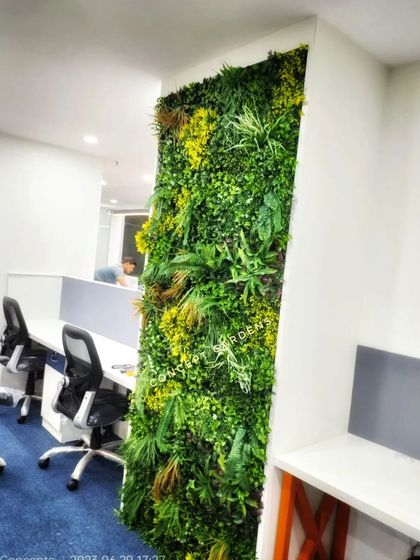 This perspective shows how a vertical garden can enhance an office corner. It adds depth and color to the workspace, making it a more pleasant and visually interesting place to be.