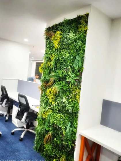 Another angle of the office partition wall, showing how it integrates seamlessly between workstations. It provides a visual break from screens and typical office decor.