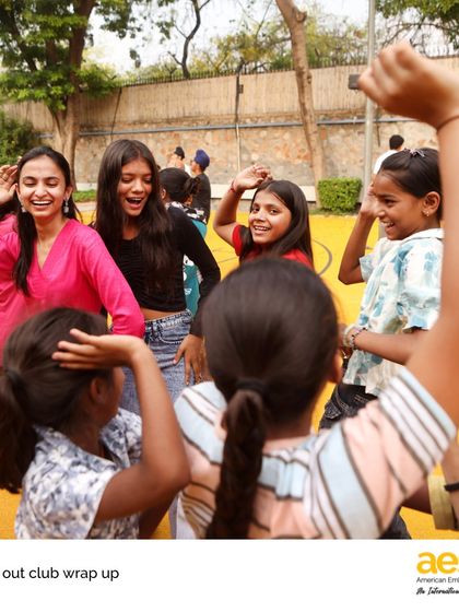Joyful smiles and dancing at the 'Reach Out!' club's end-of-year party. This club creates a vibrant community, fostering friendships and shared learning between our students and children from the local camp.