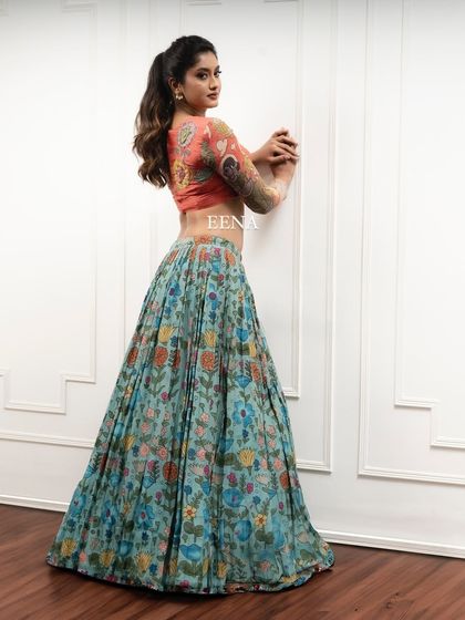 Discover the beauty of traditional craftsmanship with this stunning Pen Kalamkari lehenga. The piece is meticulously hand-painted by my artisans, with a story unfolding on the blouse sleeves and a beautiful floral pattern on the skirt and dupatta.