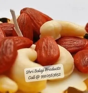 A close-up of the realistic Kaju (cashew) and Badam (almond) wax pieces made from our silicone molds. These small details are what make the dry fruit candles look so tempting.