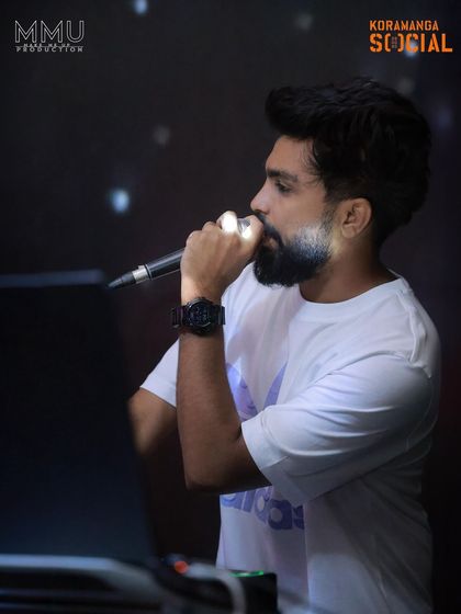 Another angle of me on the mic at Koramangala Social. I make sure my voice is heard, guiding the party's energy all night.