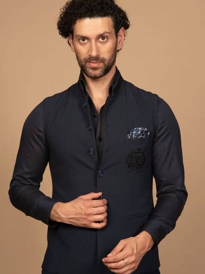Get ready to serve a classy look with my Western Jawahar jacket in navy. The embroidered pocket detail and sharp tailoring leave a lasting impression of refined style and sophistication.