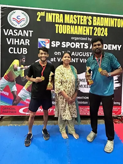 Runners-up of the Men's Doubles Group A, B, and C, Omkar and Pratik, with their awards.