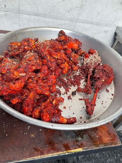 A platter of our spicy and crispy Chicken Lollipops, a favorite among guests of all ages.