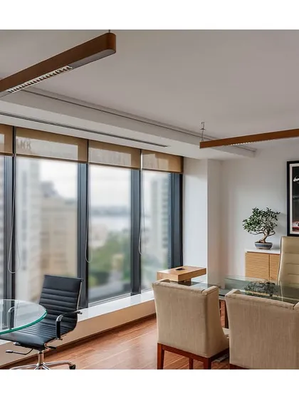 A private cabin in 'The Office with A View' with a stunning view of the Mumbai cityscape. We repurposed existing furniture and added custom lighting to create a refreshed and functional workspace for the executive.