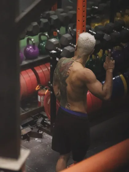 A quiet moment in the weight room. The work is done, but the mindset remains. "Will not be bitter. Will not stop." This is the internal promise a fighter makes to themselves every day.