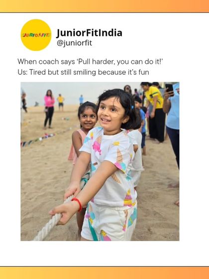Tired but still smiling because it's fun. This picture perfectly captures the spirit of JuniorFit, where challenges like tug-of-war on the beach feel more like play than a workout.