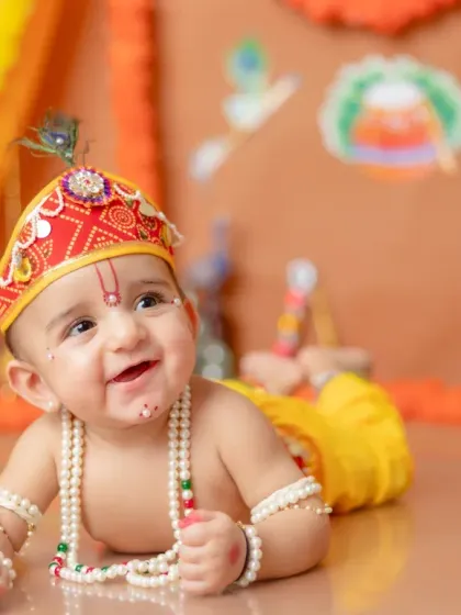 The sparkle in his eyes says it all! My Little Krishna themed shoots are a special way to celebrate our culture. I take care of all the details, from the costume to the set, to create a truly divine portrait of your little Kanha.
