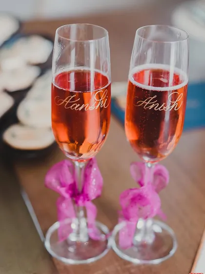 Personalized champagne flutes for the couple. These small, elegant touches are the keepsakes that will be cherished for years to come.