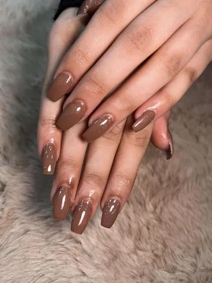 A rich, chocolate brown polish on square-shaped extensions. A perfect neutral for any skin tone.