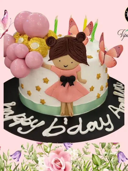 This custom cake features a hand-made fondant girl holding balloons, perfect for a special birthday. All my cakes are 100% eggless and can be customized to any theme you can imagine.