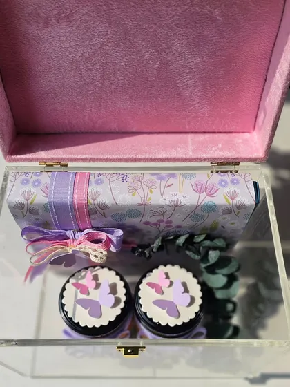 Welcoming a beautiful baby girl with a hamper that is very close to my heart. This gorgeous acrylic box holds beautifully wrapped treats and jars, detailed with paper butterflies and delicate ribbons.
