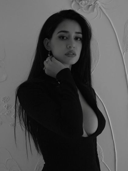 A direct and captivating look from the 'Gustaakh Ishq' music video. The makeup focuses on defined eyes and brows to create a strong and expressive gaze.