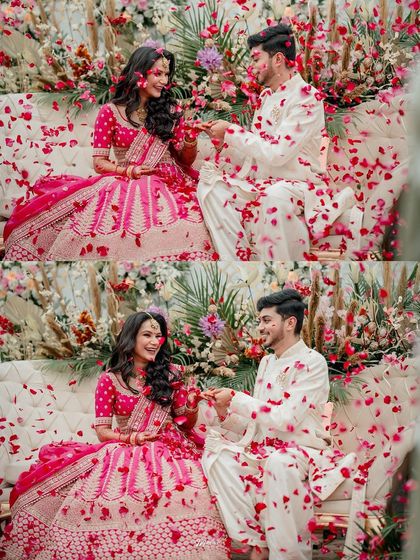A playful moment of the couple being showered with rose petals, their laughter and joy filling the frame.
