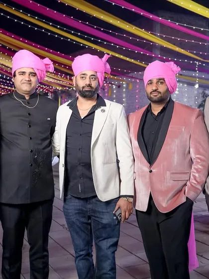 The groom's party, all wearing matching pink turbans (pagdis). We love capturing these traditional elements and the sense of unity they bring.