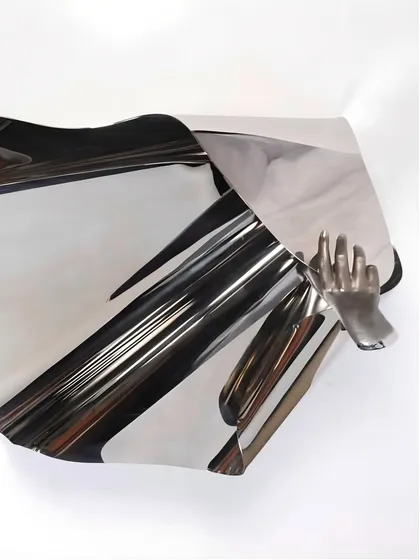 The reflective surface of "The Power of Being" creates an illusion of movement and lightness.