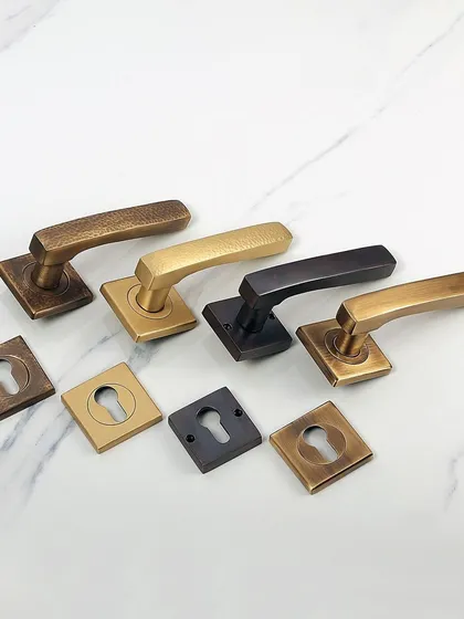 This is my Martel Lever Handle, available in both plain and hammered textures. Displayed here in four different finishes, it shows how a simple change in texture and color can transform a modern hardware design to fit any interior door or large cabinet.