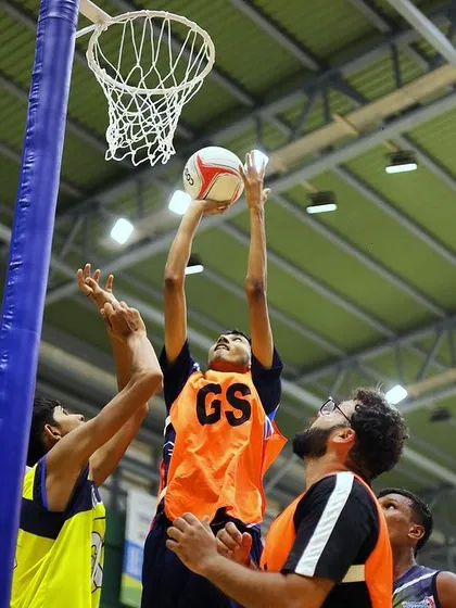 Freezing peak action is what we do best in sports photography. This close-up from the National Games Netball Championship captures the critical moment a Goal Shooter scores, showing the intensity and athleticism of the players. We use fast shutter speeds on our Nikon gear to ensure every detail is sharp and impactful.
