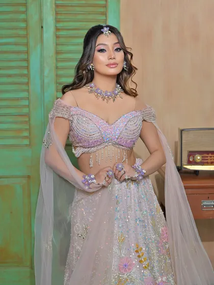 Another angle of this stunning look, showing the off-shoulder blouse and the delicate floral jewellery.