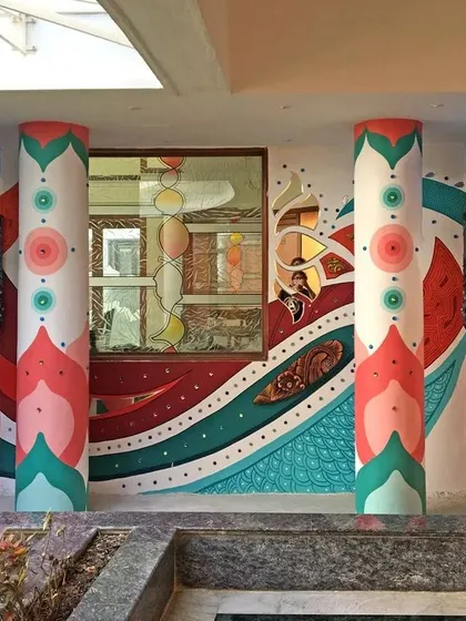Our work goes beyond traditional themes. Here is a contemporary art installation we designed for a building's entrance, combining bold 2D patterns with protruding 3D sculpted elements to create a dynamic and modern look that completely transforms the space.