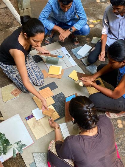 The collaborative process of material selection, with multiple team members contributing ideas.