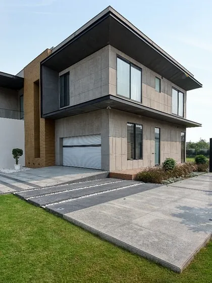 A photograph of our completed farmhouse project in Sonipat. Here, we focused on clean lines, natural materials, and a strong connection to the landscape. The design balances modern aesthetics with the comfort and scale of a countryside residence.